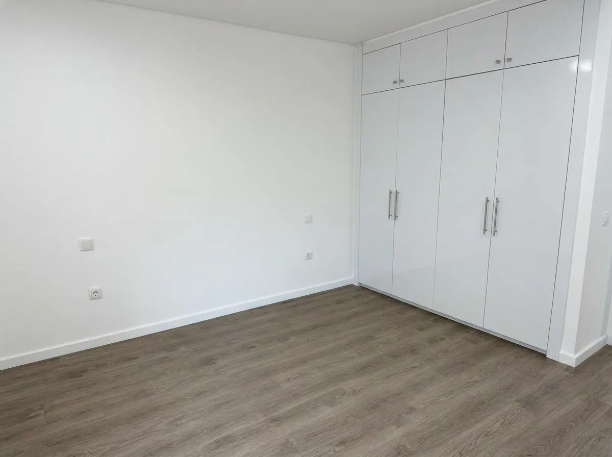 A villa bedroom, empty before our setup
